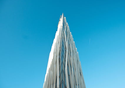 white building under blue sky thumbnail
