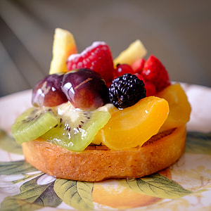 baked pastry with sliced of fruits on top thumbnail