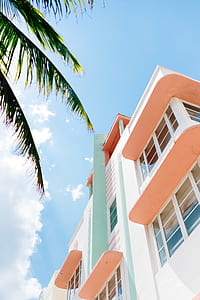 pink and white concrete high-rise building thumbnail