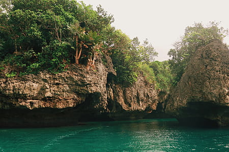 Rocky Cliff and Emerald Green Water View thumbnail