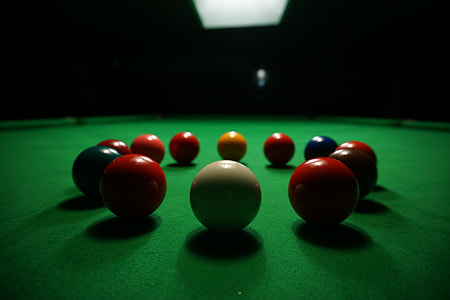 shallow focus photography of billiard balls on green billiard table thumbnail