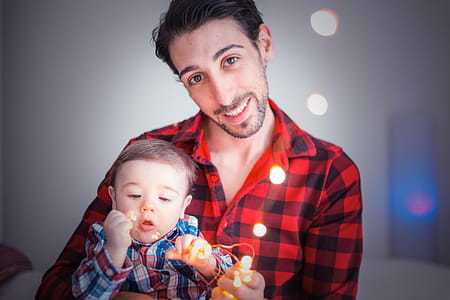 Man Carrying Toddler thumbnail