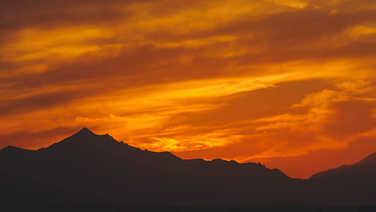 silhouette of mountain during golden hour thumbnail
