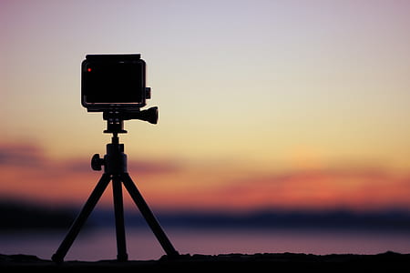 silhouette of action camera on tripod thumbnail