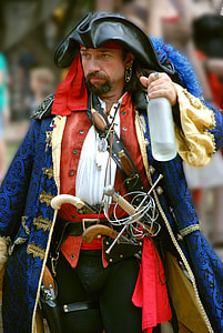 photo of man in pirate costume holding clear glass bottle thumbnail