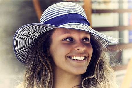 woman wearing blue-and-white striped hat thumbnail