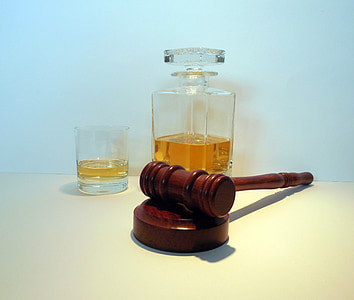 brown wooden mallet beside clear glass decanter thumbnail