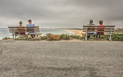 four person sitting on two benches thumbnail