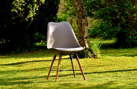 gray chair on green grass field thumbnail