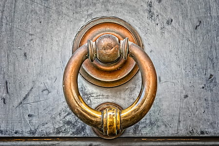 close-up photo of brass-colored door knocker thumbnail
