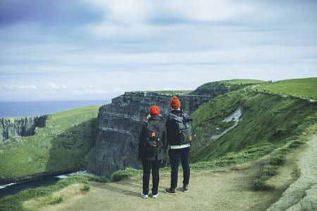 two person standing on top of hill thumbnail