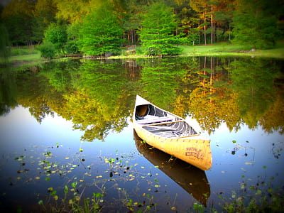 yellow canoe boat on lake thumbnail