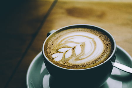 coffee latte inside teal teacup with saucer thumbnail