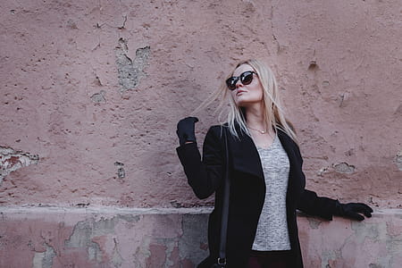 Woman Leaning on Pink Painted Wall thumbnail