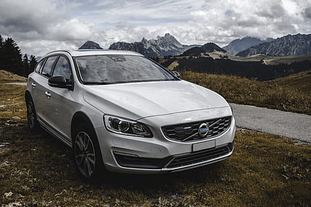 silver Volvo sedan parked on grass field thumbnail