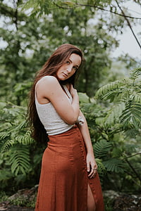 woman standing near green leafed plant thumbnail