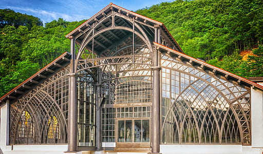 glass house near mountain thumbnail