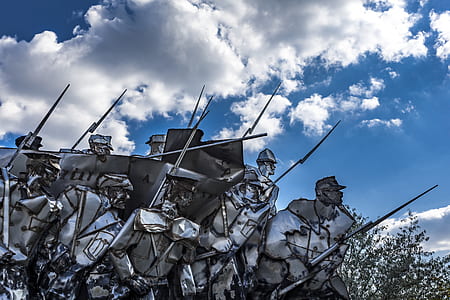 gray soldier illustration during daytime thumbnail
