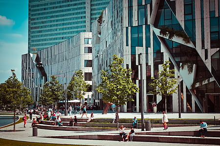 group of people in front of glass building thumbnail