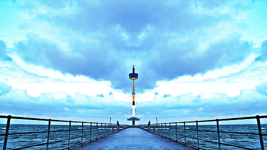 lighthouse on body of water thumbnail