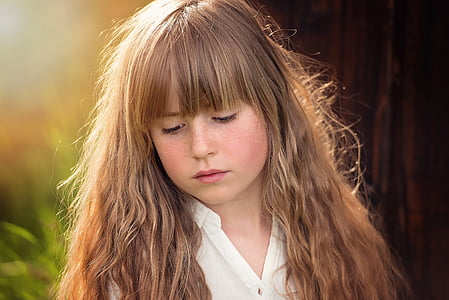 girl wearing white collared shirt beside tree thumbnail
