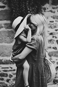 woman carrying child thumbnail
