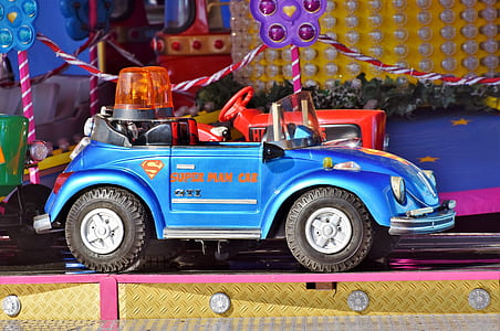 unoccupied blue ride-on toy car thumbnail