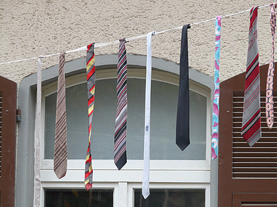 assorted-color of necktie lot near building thumbnail