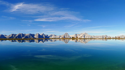 panoramic photo of rock formations and sea during daytime thumbnail