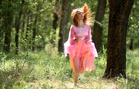 woman wearing pink dress running forward thumbnail