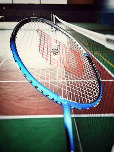 closeup photo of blue Wilson badminton racket thumbnail