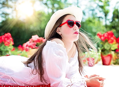 woman wearing white off-shoulder shirt and heart sunglasses thumbnail
