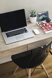 MacBook Pro on brown wooden desk thumbnail