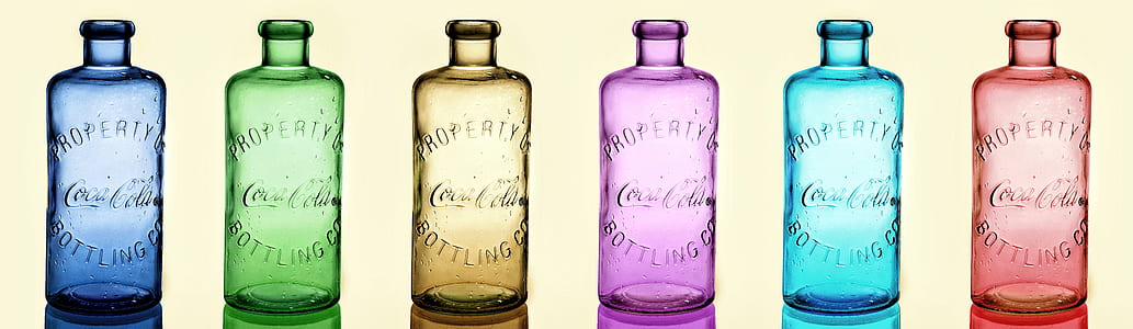 six assorted-color glass bottles thumbnail