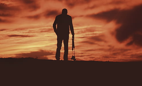silhouette of a man holding a camera thumbnail