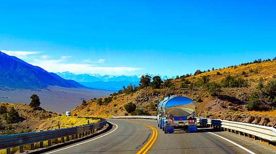 tank trailer passing through mountain thumbnail