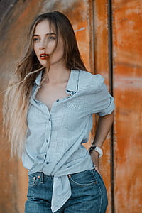 woman posing in blue button-up shirt thumbnail