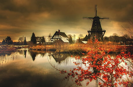 landscape reflection photography of water mill near lake thumbnail