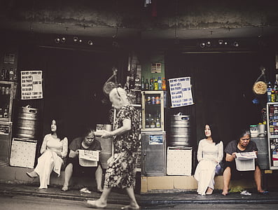 two women sitting in front of store thumbnail
