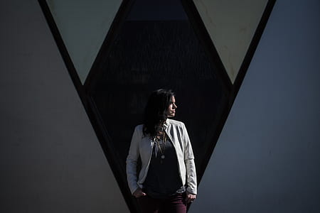woman looking left in front of wall thumbnail