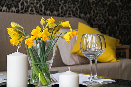 yellow petaled flower in vase on table thumbnail