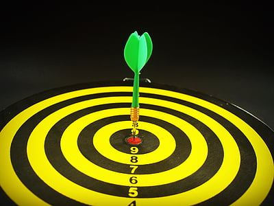 green dart pin on dartboard bullseye thumbnail