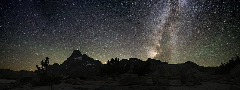mountain under gray and black sky during nighttime thumbnail
