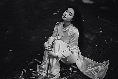 graysacle photo of woman sitting thumbnail