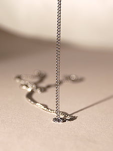 closeup photo of silver-colored necklace thumbnail