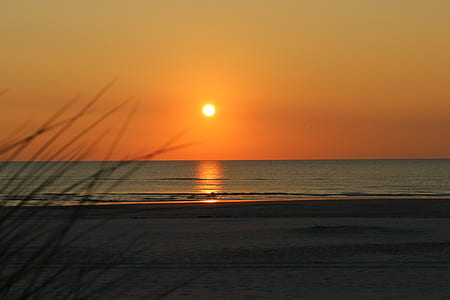 waves rushed to shore during sunset thumbnail