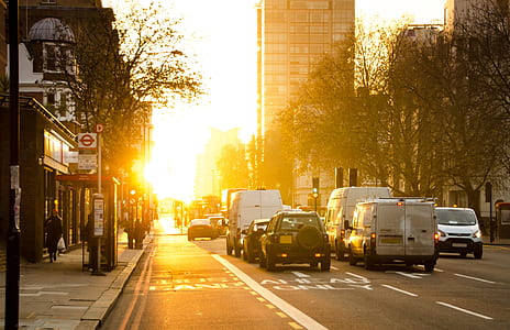 vehicle on road near building at sunset thumbnail