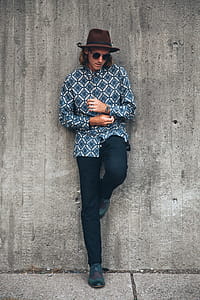 Young Man Leans On Wall Photo thumbnail