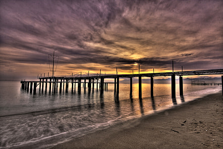 sunset behind dock thumbnail
