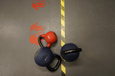 three assorted-color kettle dumbbells thumbnail